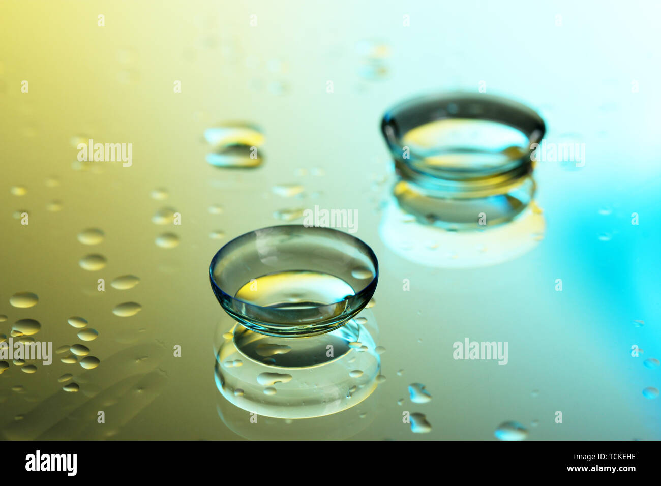 contact lenses, on yellow-blue background Stock Photo