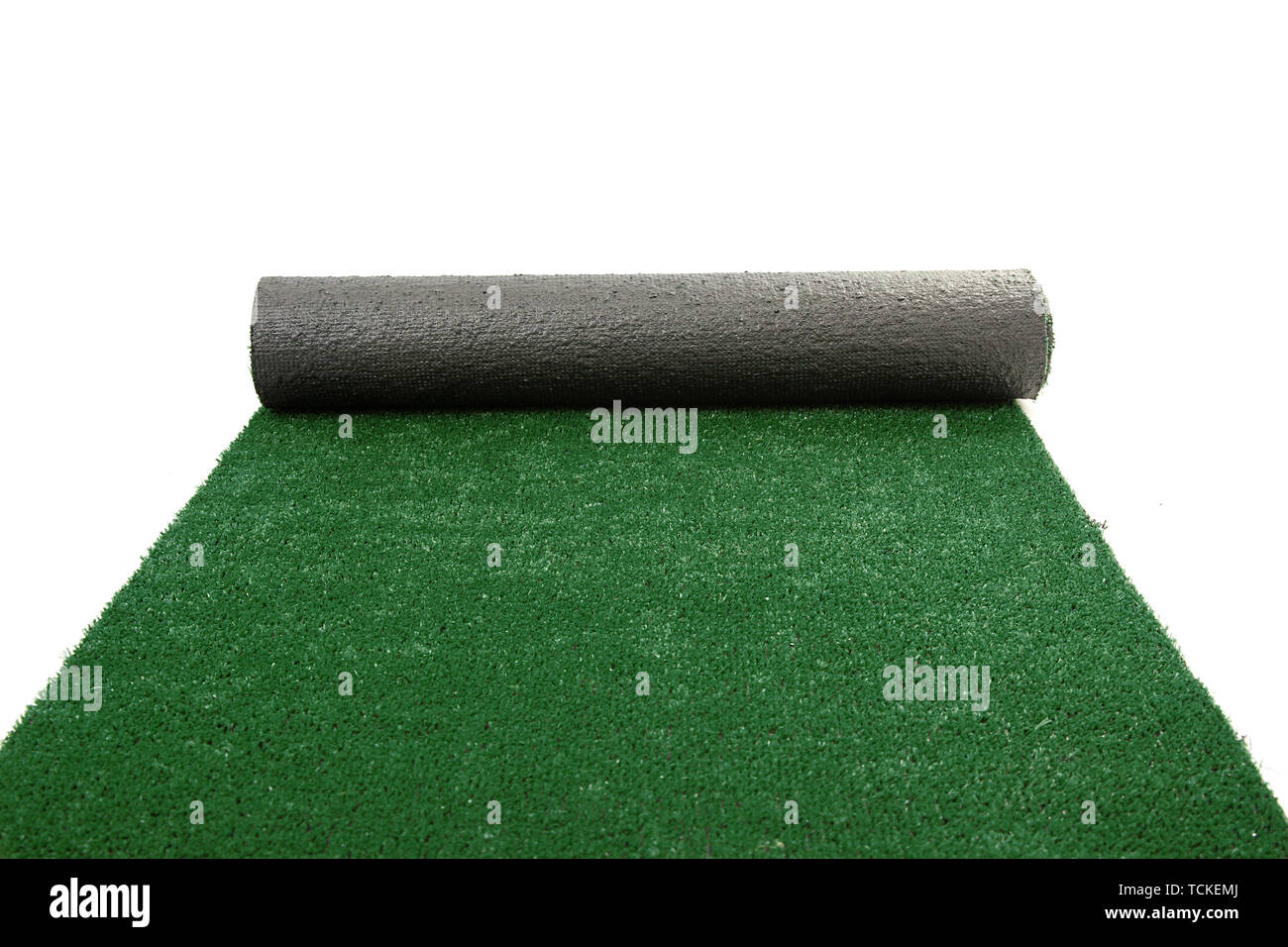 Artificial rolled green grass isolated on white Stock Photo