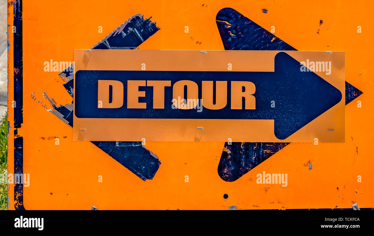 Panorama Close up of a weathered orange and blue Detour sign with arrow Stock Photo Alamy
