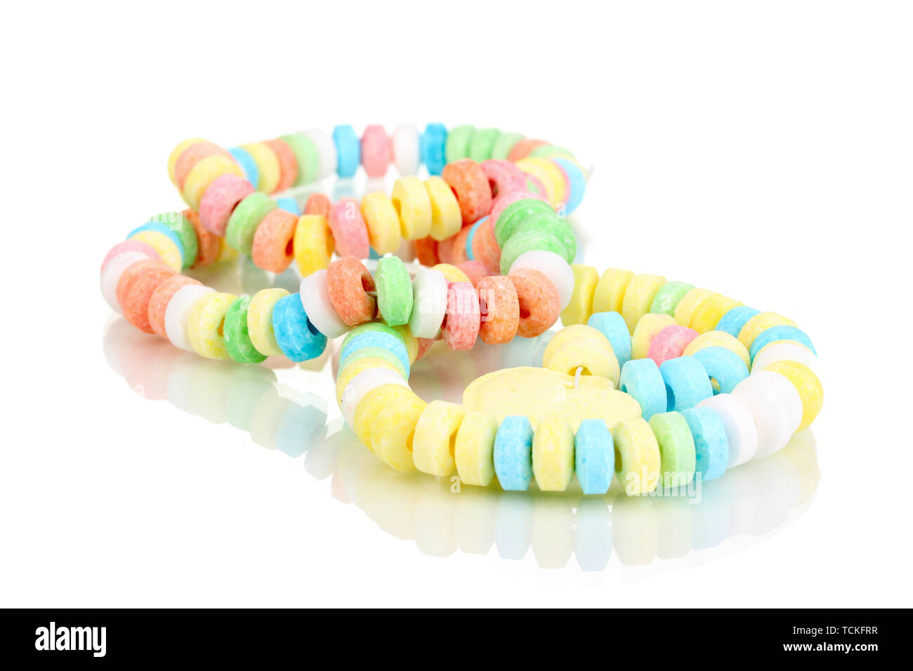 Color candies on rope isolated on white Stock Photo - Alamy