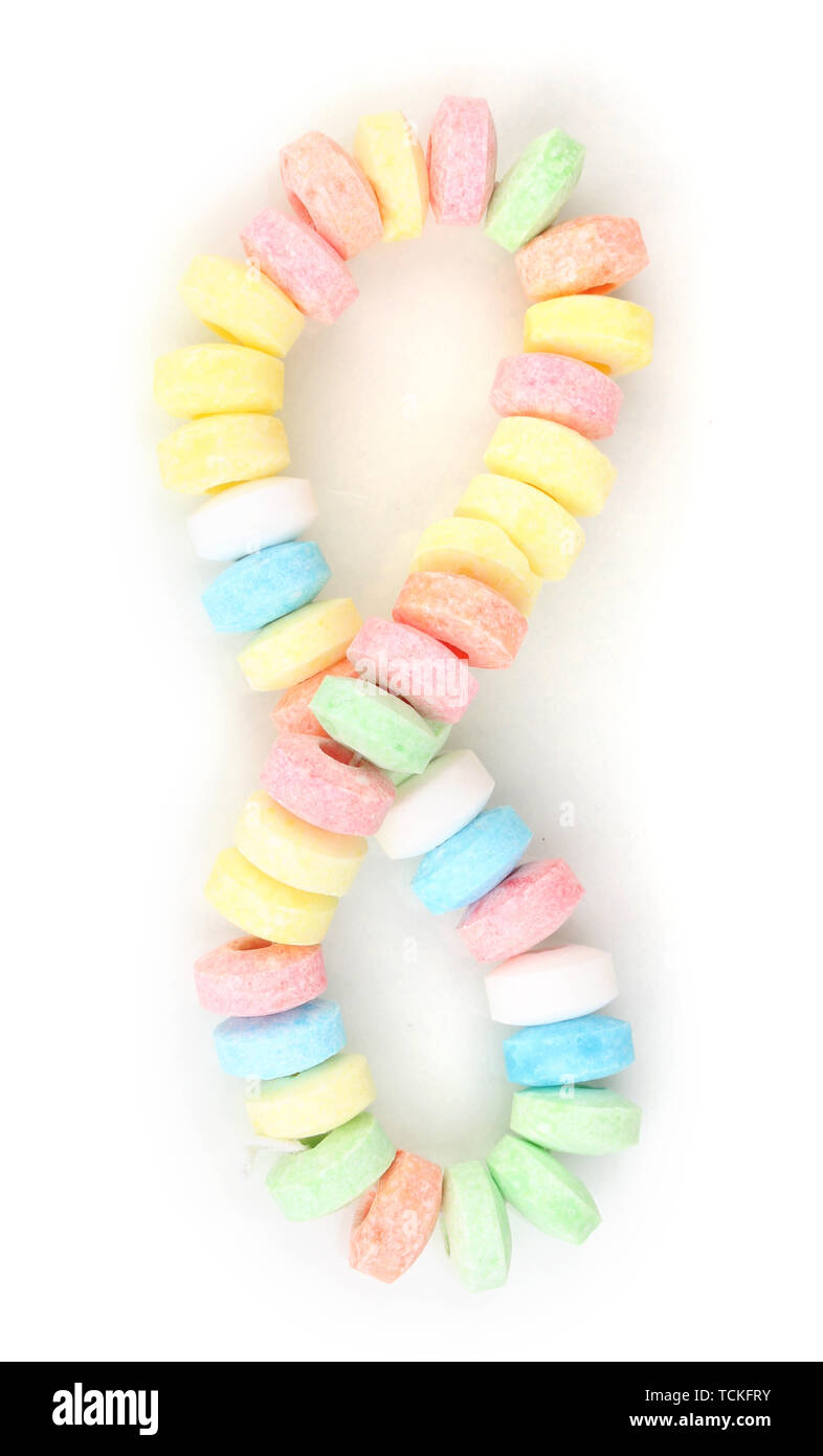 Color candies on rope isolated on white Stock Photo - Alamy