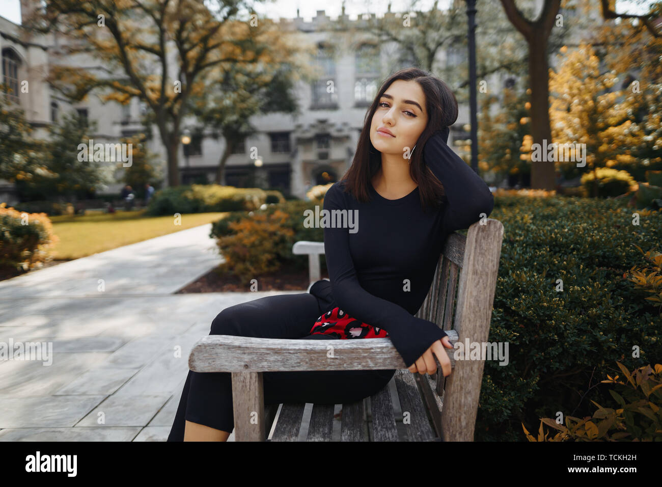 School girl sitting on bench hi-res stock photography and images - Alamy
