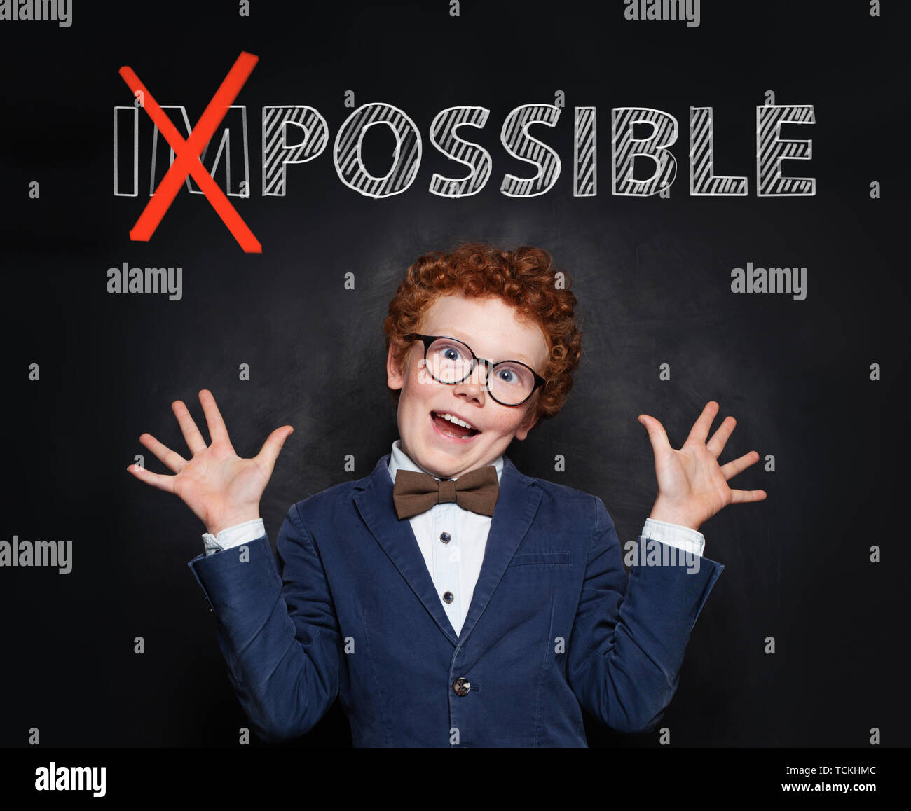 Happy mischievous child boy with text possible on chalkboard background