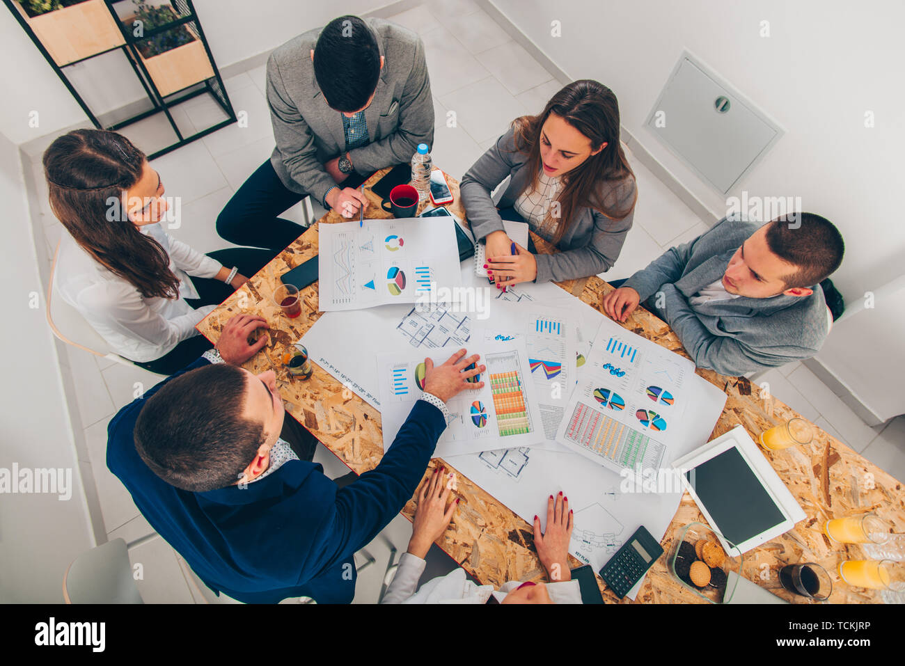 Group of ambitious designers are looking at the diagram Stock Photo - Alamy