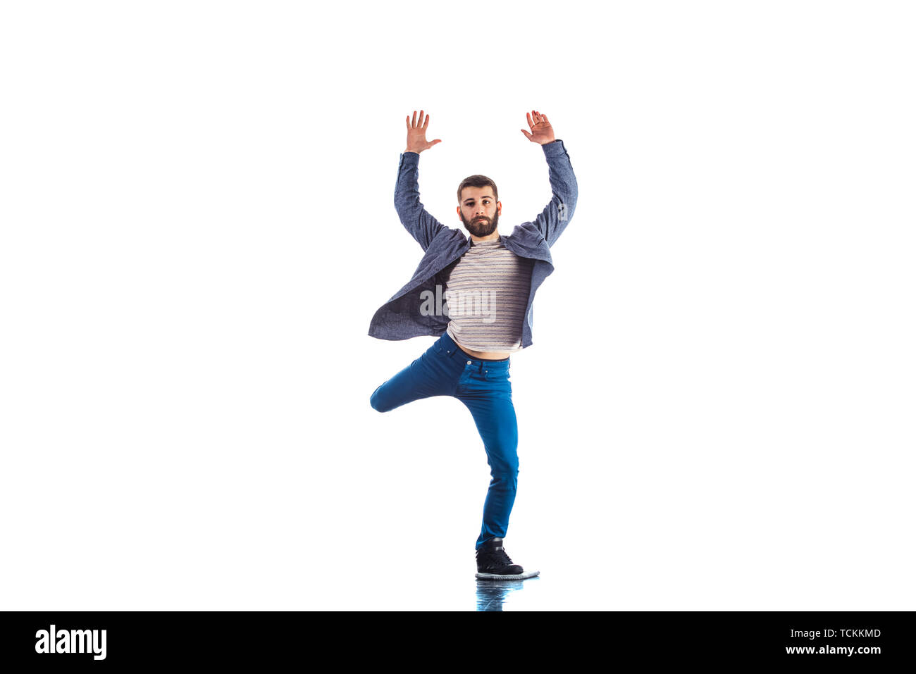 Man in studio is doing freeestyle breakdance Stock Photo