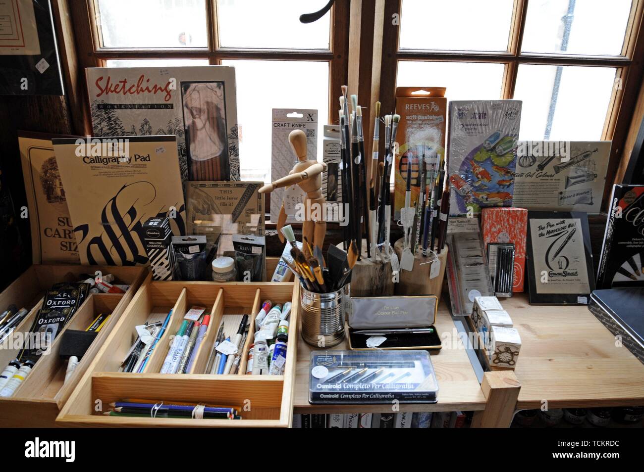 Artists materials and drawing instruments on display in an antiques