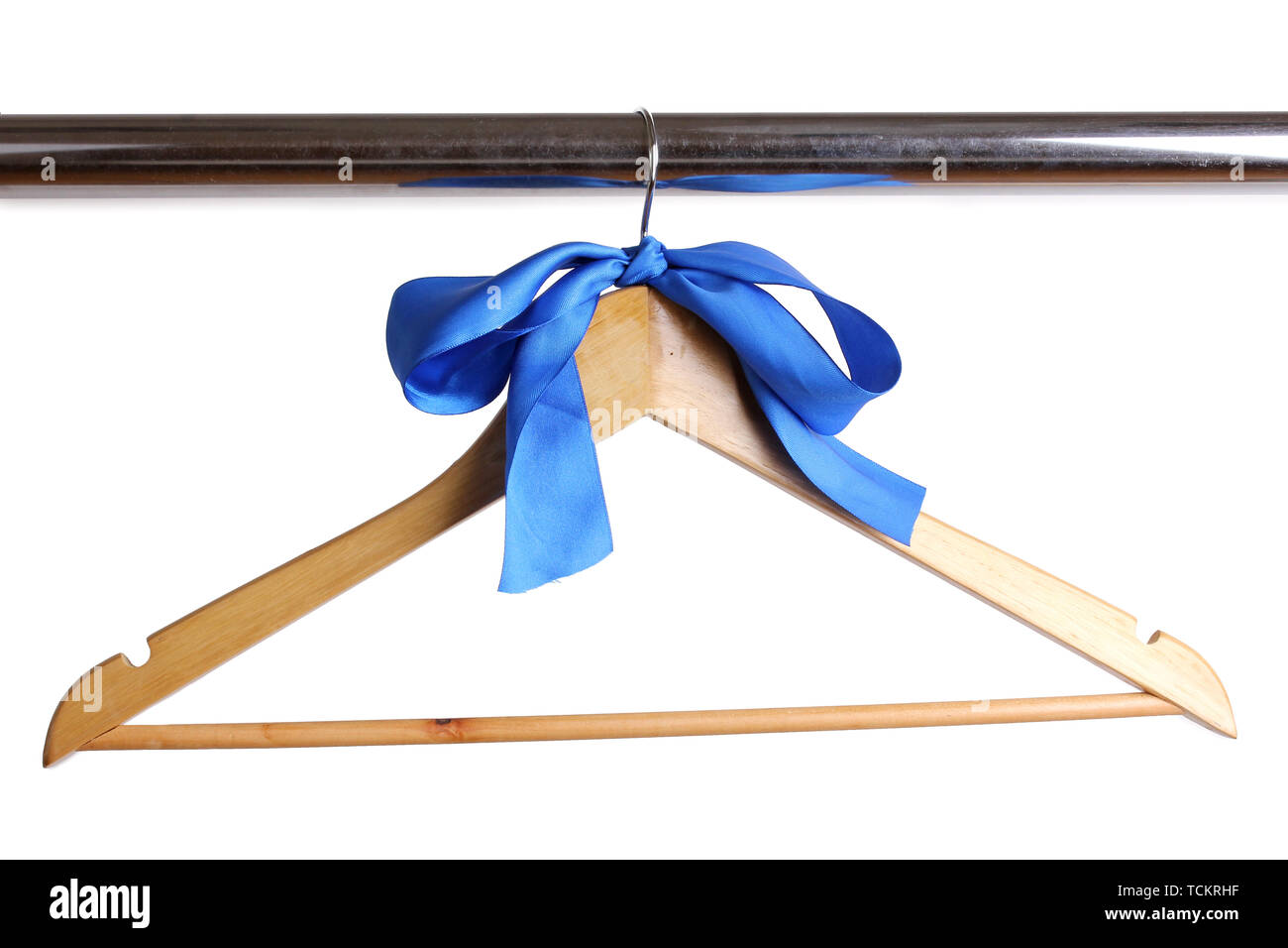 Beautiful blue bow hanging on wooden hanger isolated on white Stock Photo
