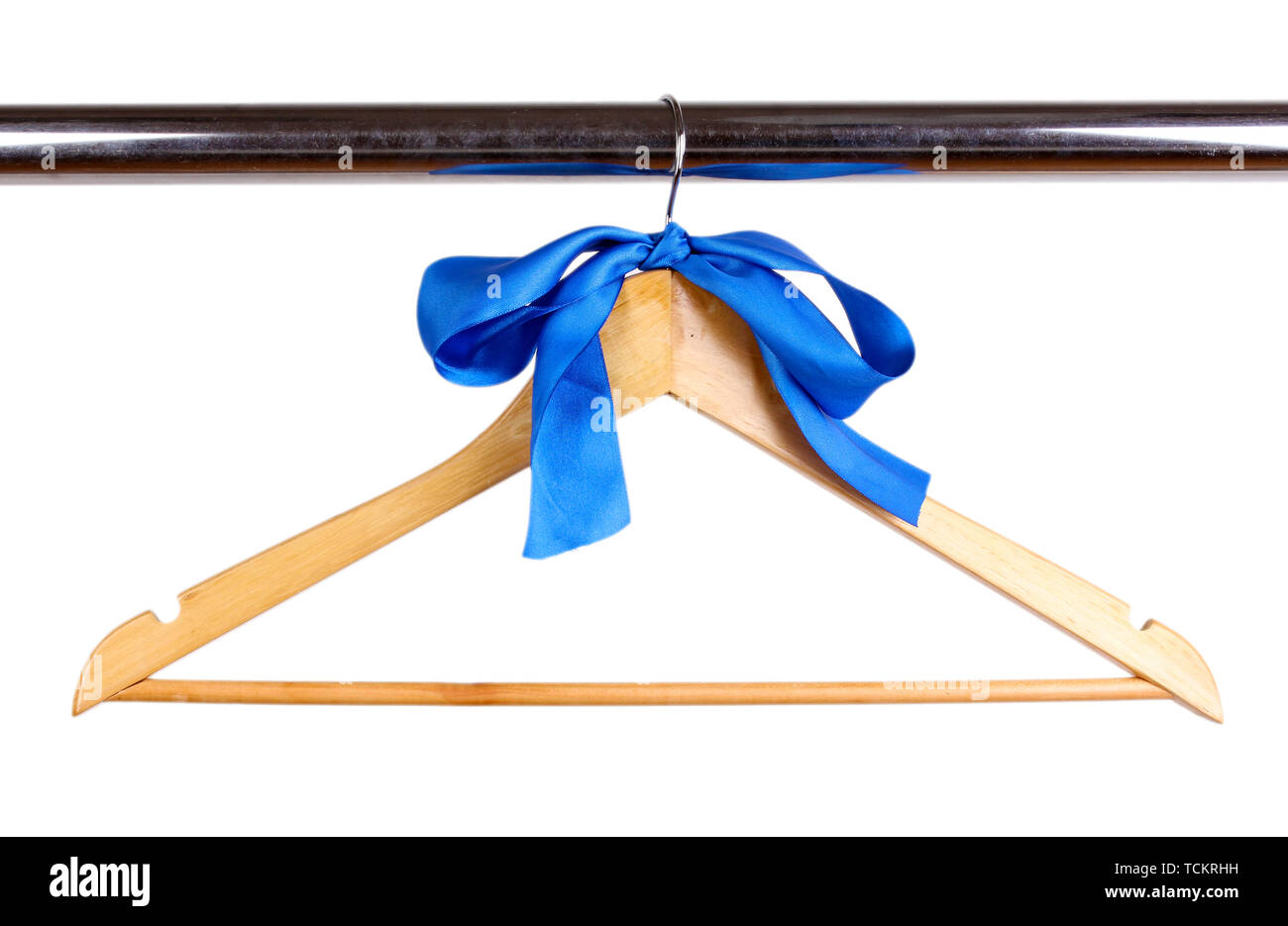 Beautiful blue bow hanging on wooden hanger isolated on white Stock Photo