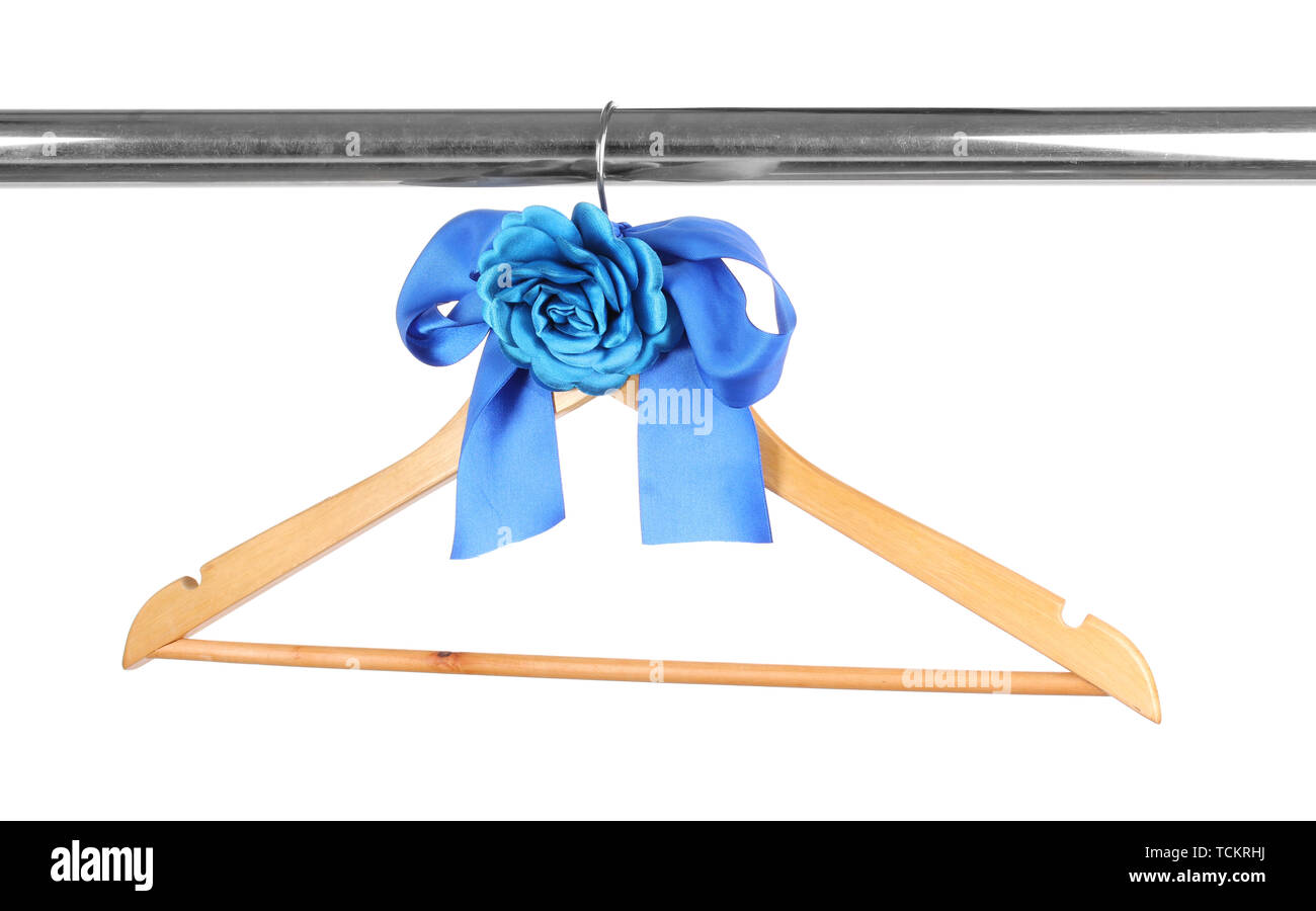 Beautiful blue bow hanging on wooden hanger isolated on white Stock Photo