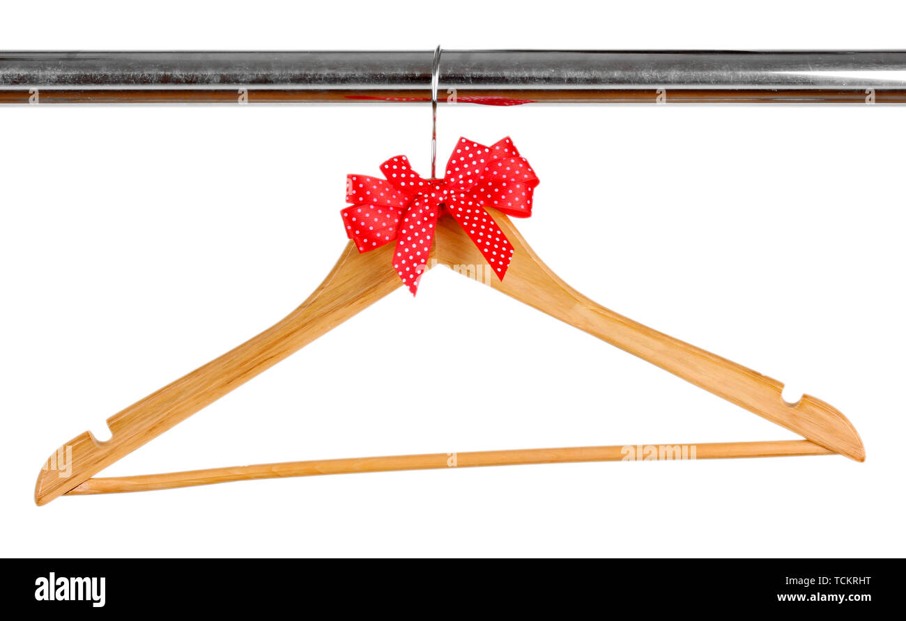 Beautiful red bow hanging on wooden hanger isolated on white Stock Photo