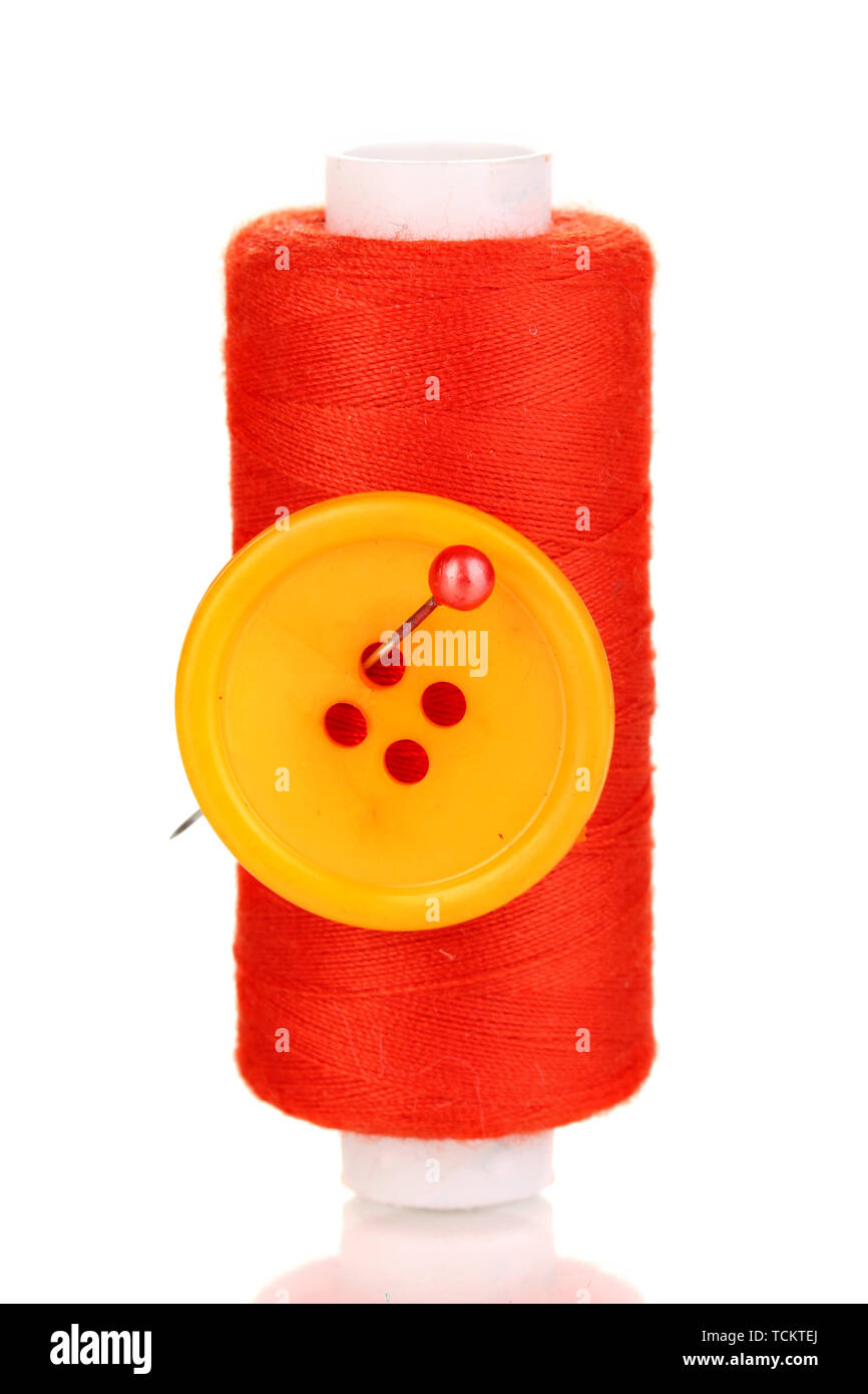 Yellow bobbin with needle and buttons isolated on white Stock Photo - Alamy