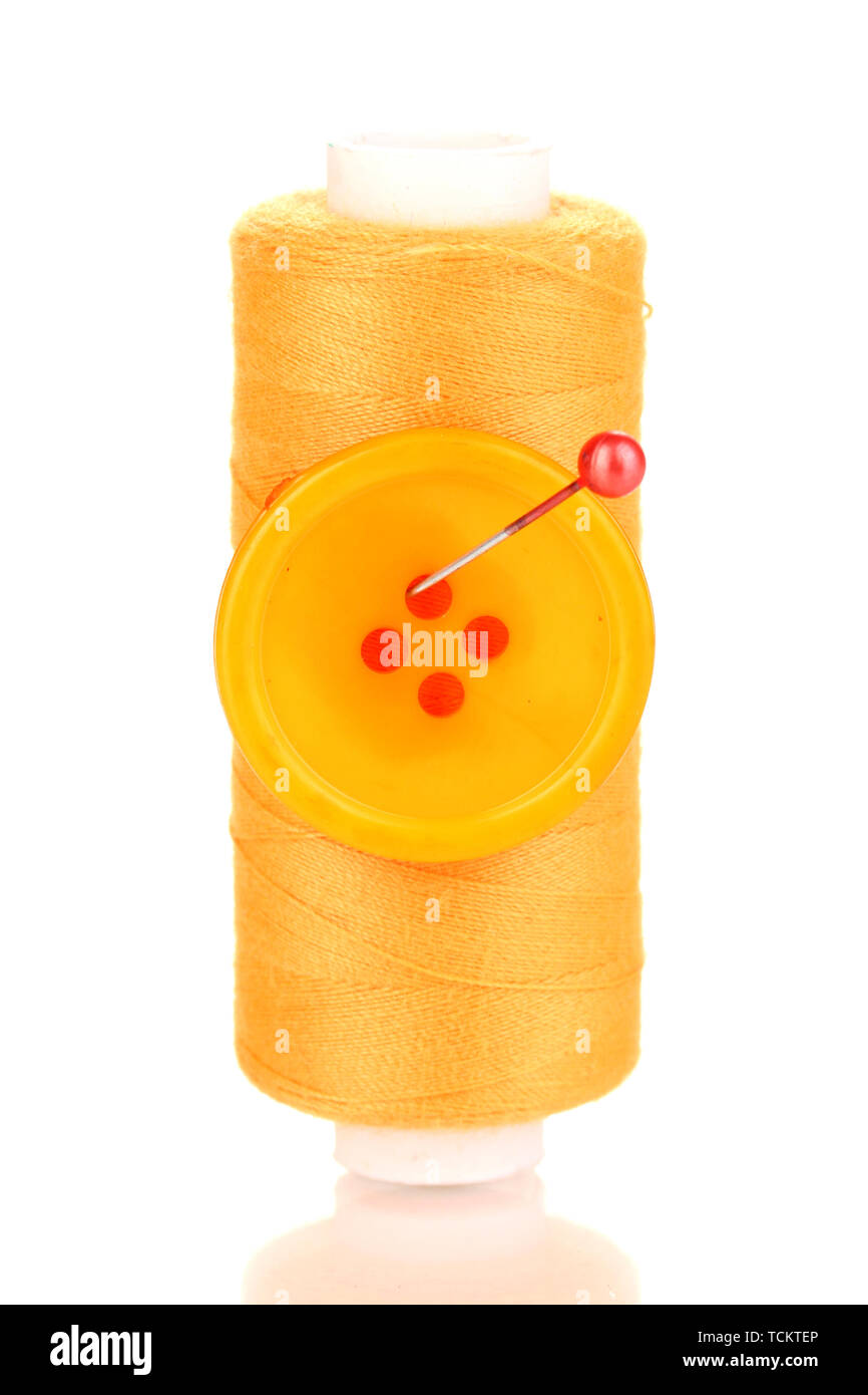 Yellow bobbin with needle and buttons isolated on white Stock Photo - Alamy