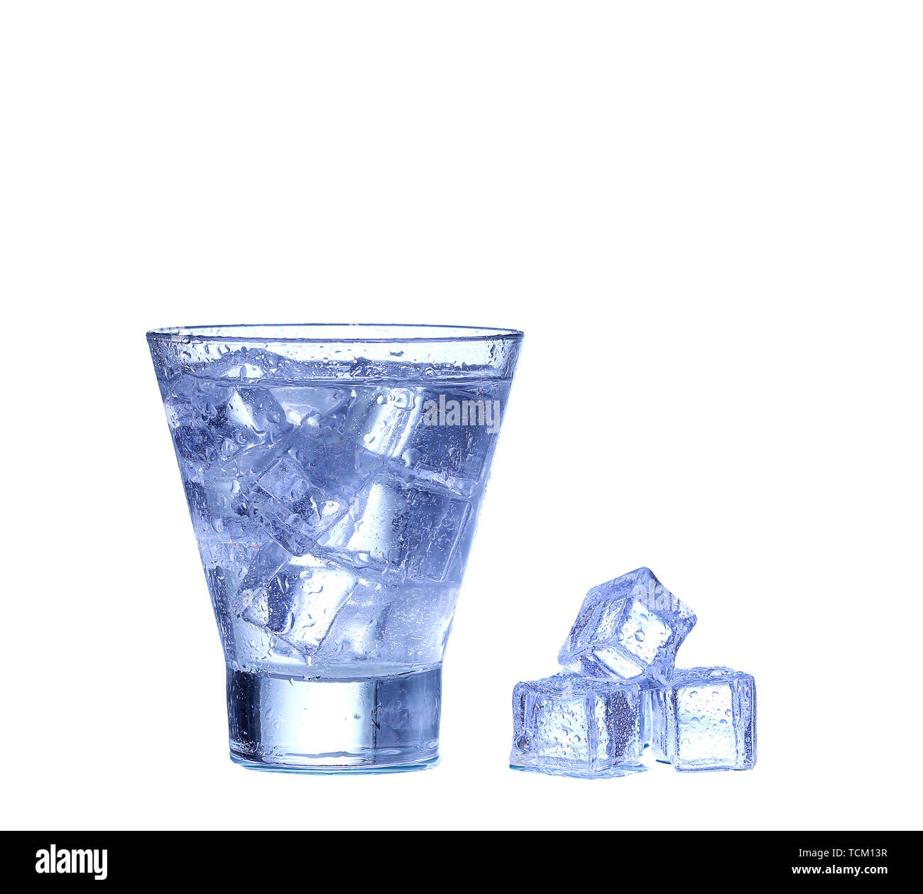 Glass of water, ice and slice of fresh lemon on a white background ...