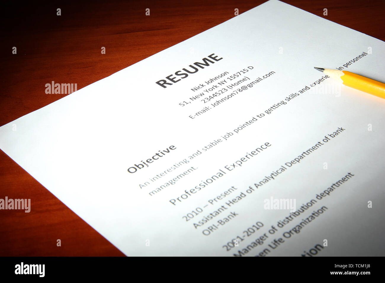 Closeup of resume with pencil on - Closeup Of Resume With Pencil On Wooden Table TCM1J8 