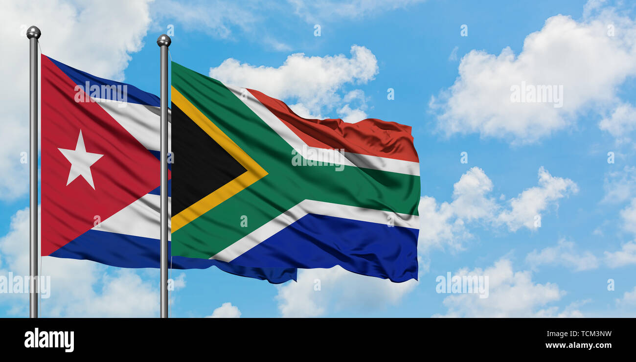 Cuba and South Africa flag waving in the wind against white cloudy blue ...