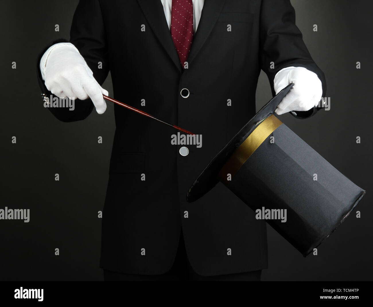 magician performance on dark background Stock Photo - Alamy