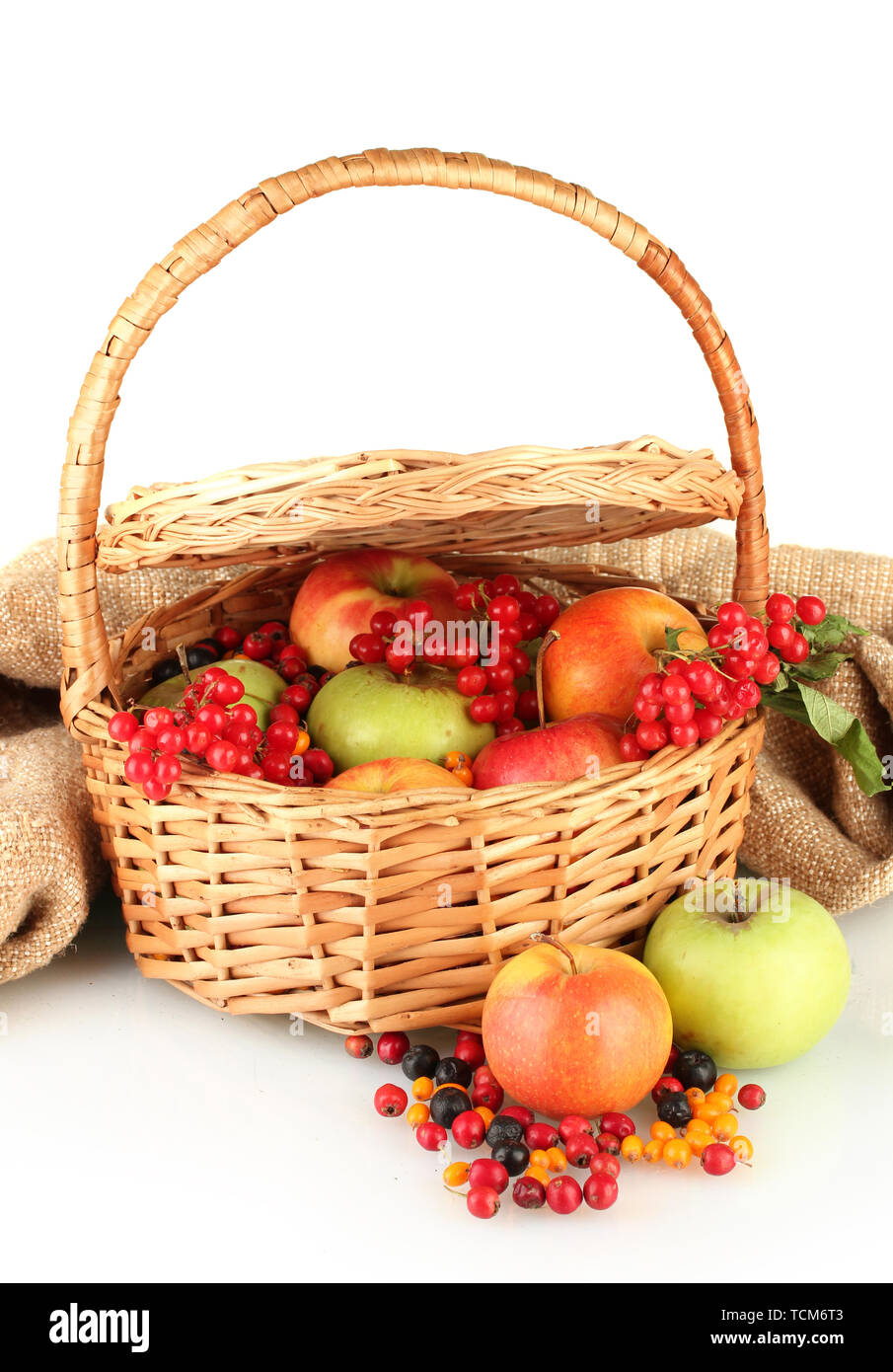 crop of berries and fruits in a basket on white background close-up Stock Photo