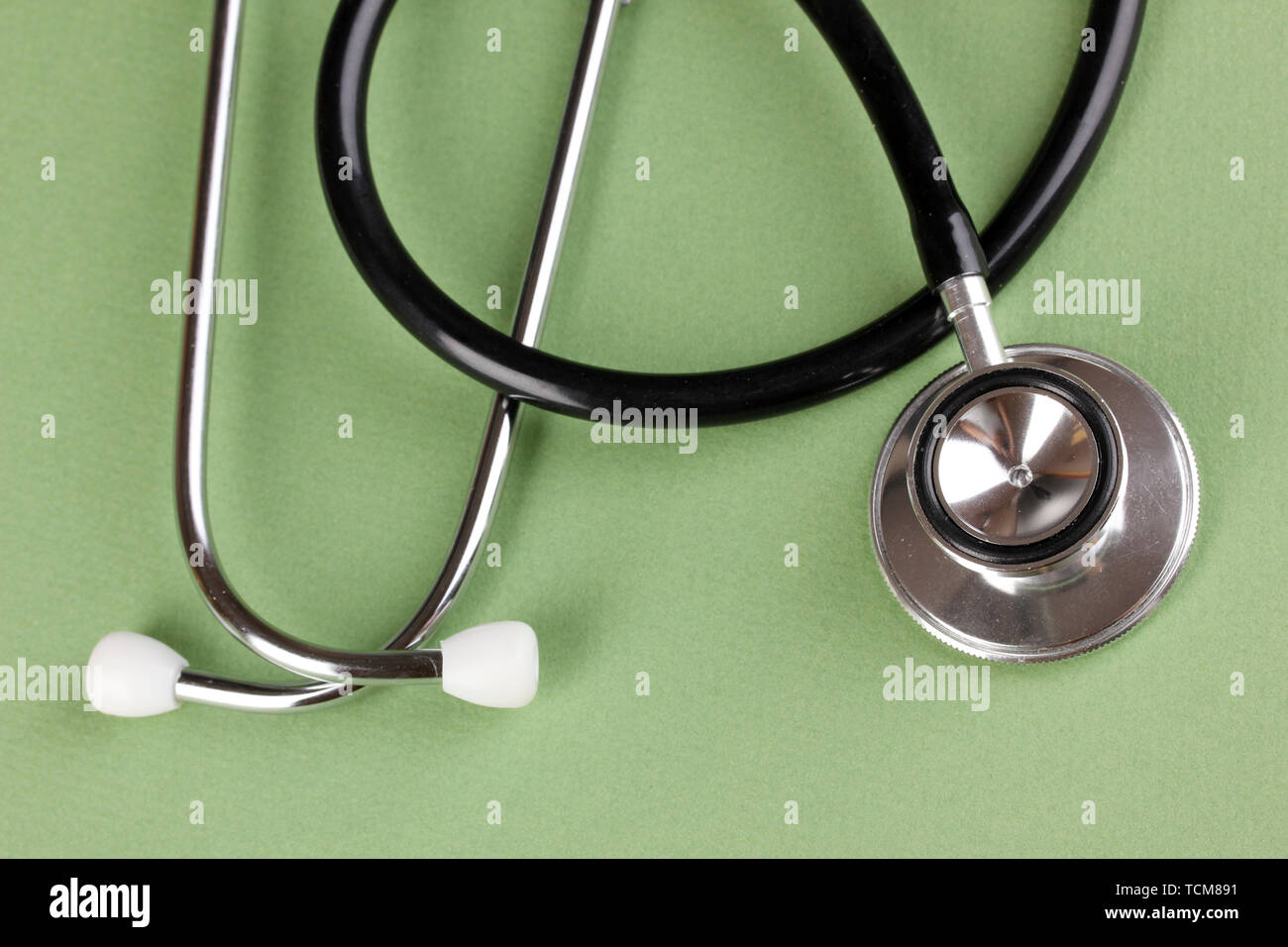 Stethoscope on green background Stock Photo - Alamy