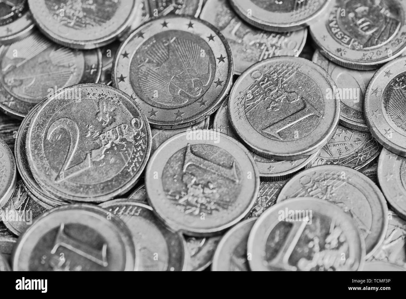 black and white picture background with one and two Euro coins format filling Stock Photo