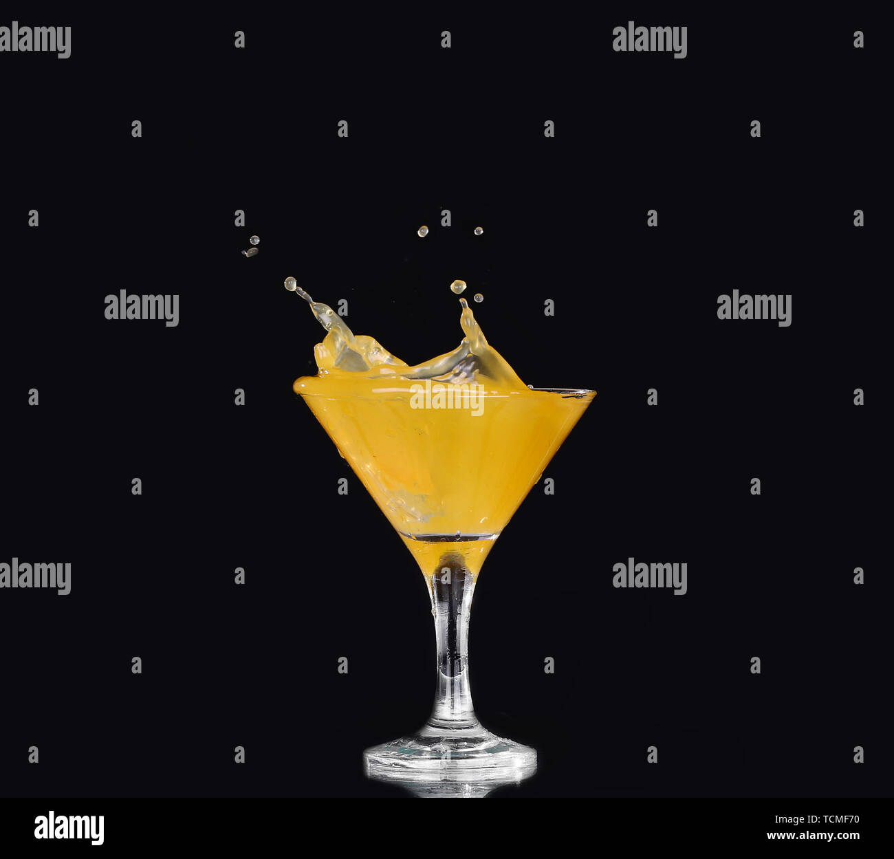 Orange juice splash on blackground Stock Photo - Alamy