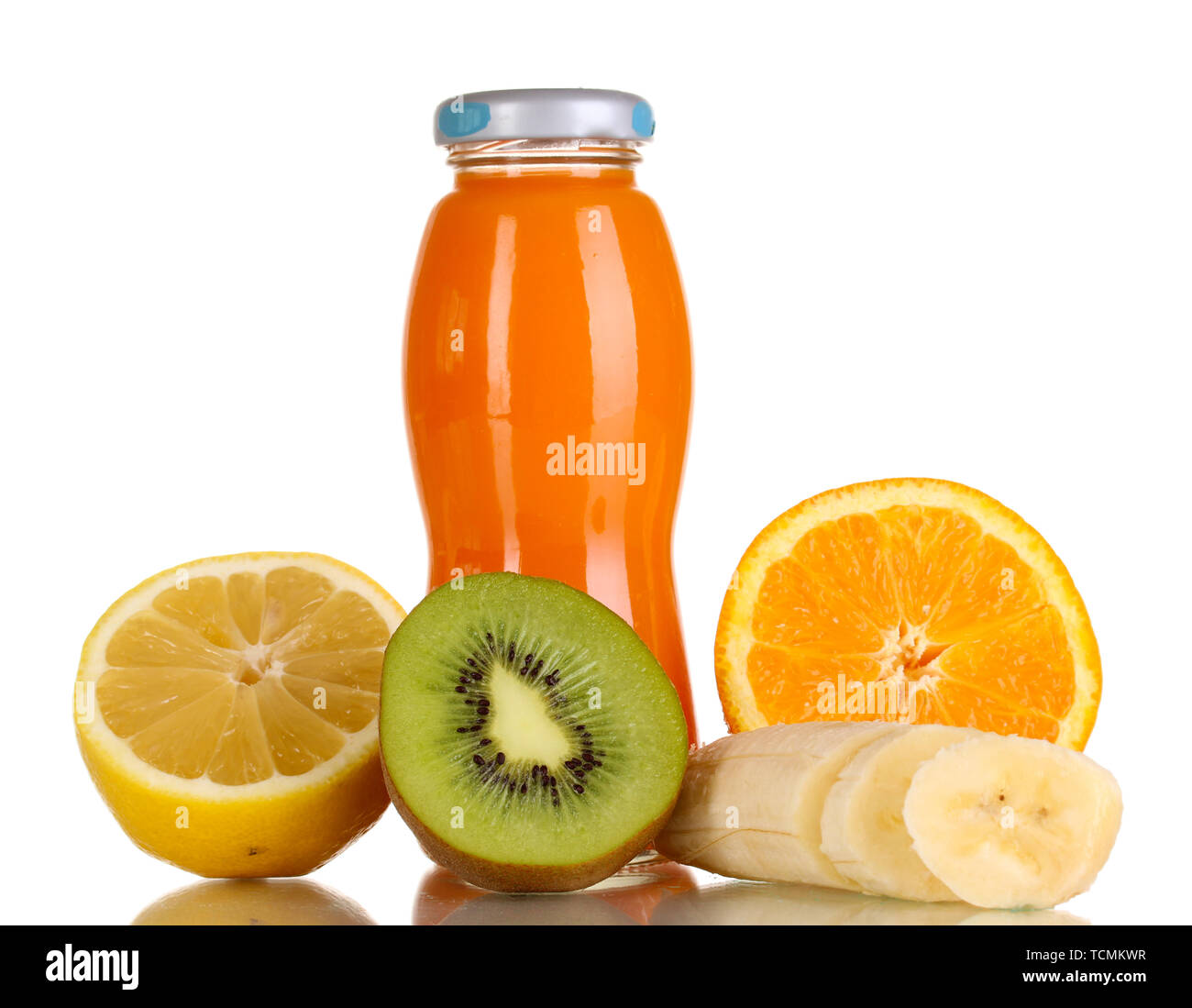 Delicious multifruit juice in a bottle and fruit next to it isolated on