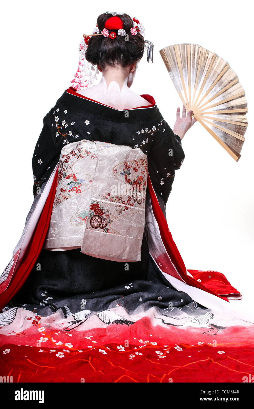 young pretty geisha in kimono with sakura and decoration. Portrait of a  Japanese geisha woman isolated on white Stock Photo - Alamy