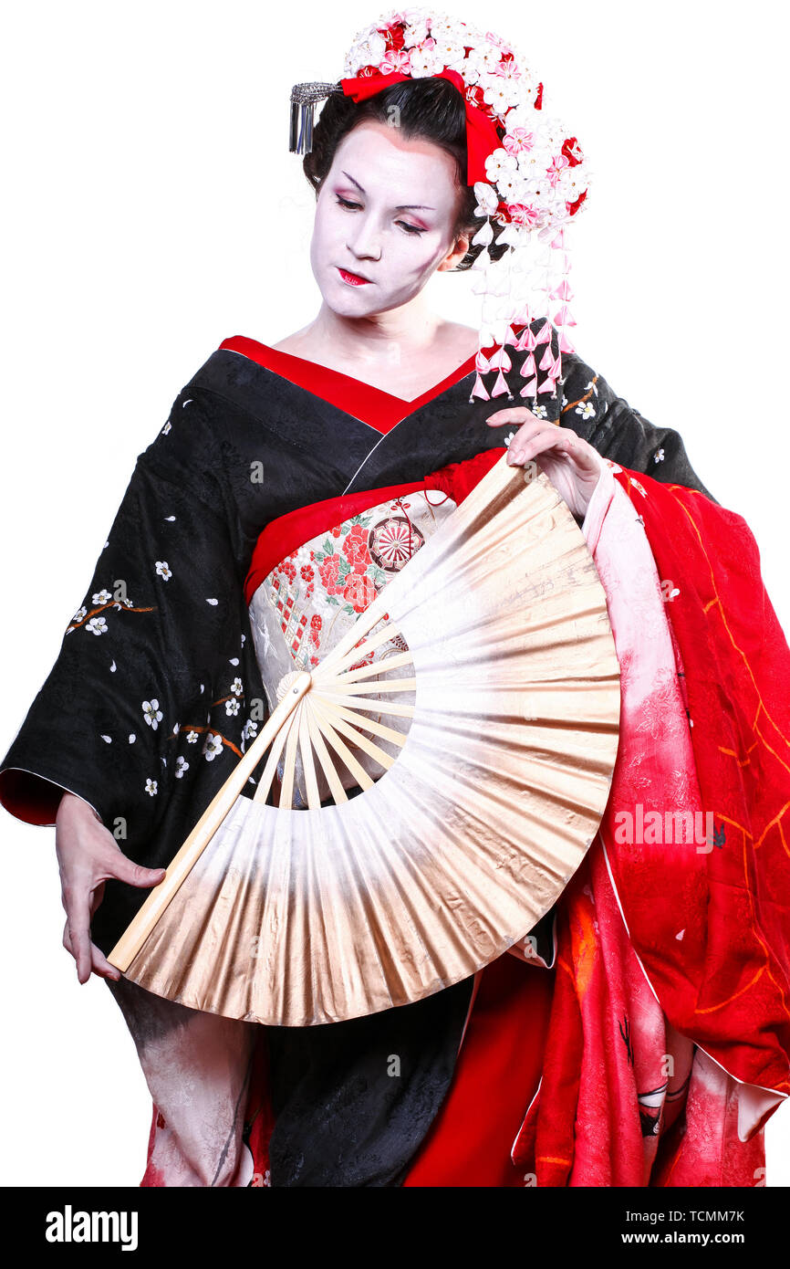 young pretty geisha in kimono with sakura and decoration. Portrait of a ...