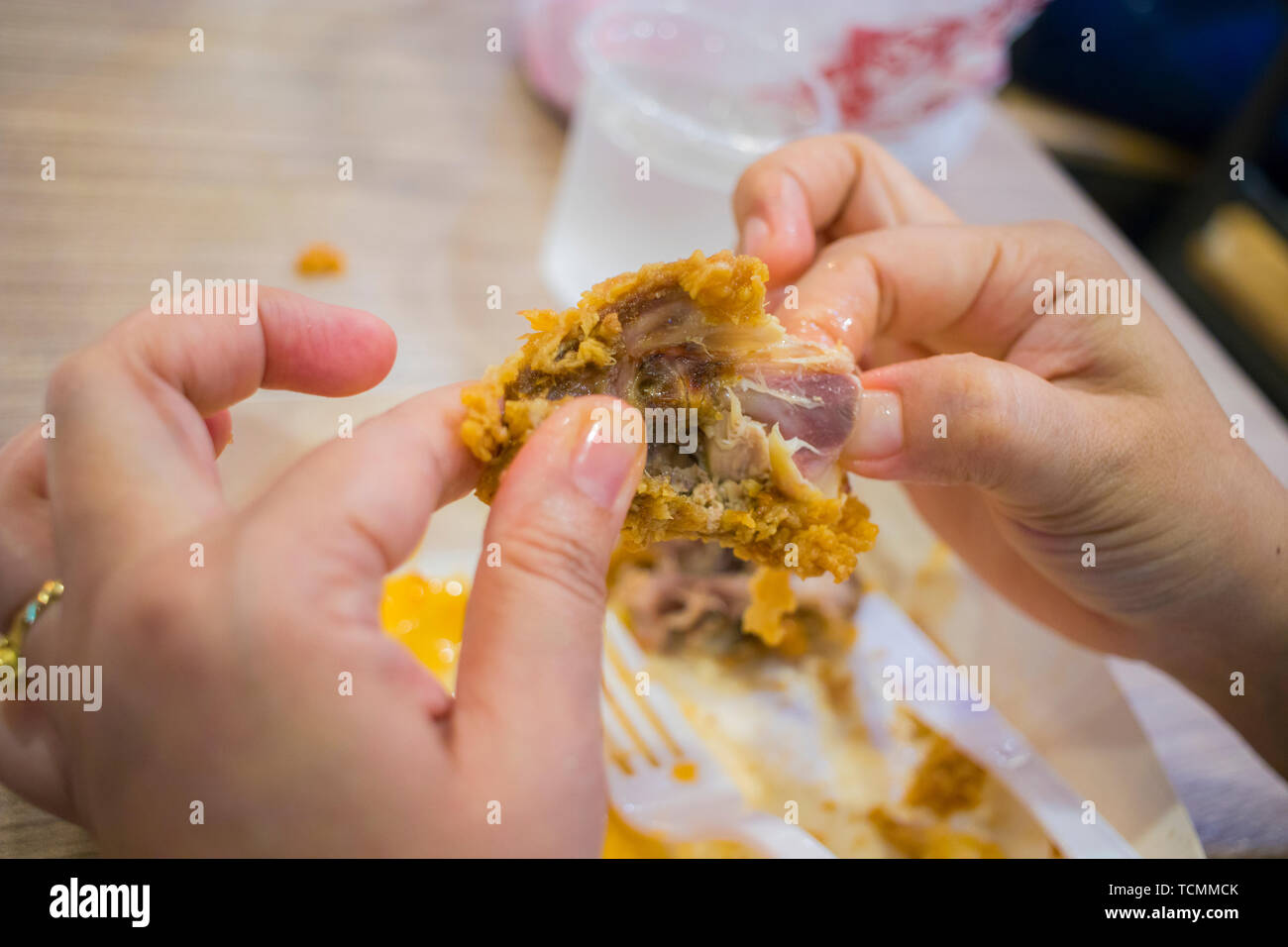 Asian Women Eating Fried Chicken Focus Woman Hand Hold Fried Chicken For Eat Girl With Fast Food Concept High Resolution Image Gallery Stock Photo Alamy
