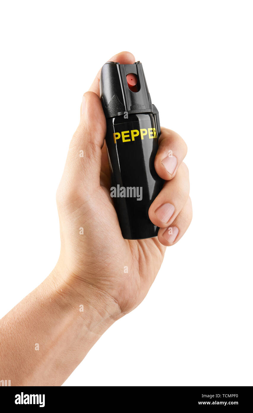 Tear gas or pepper spray in hand, isolated on white background Stock Photo