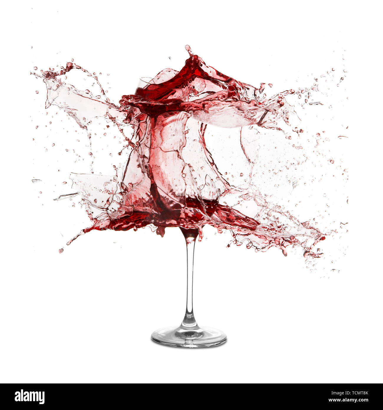 Explosion of a glass with red wine on a white background Stock Photo - Alamy