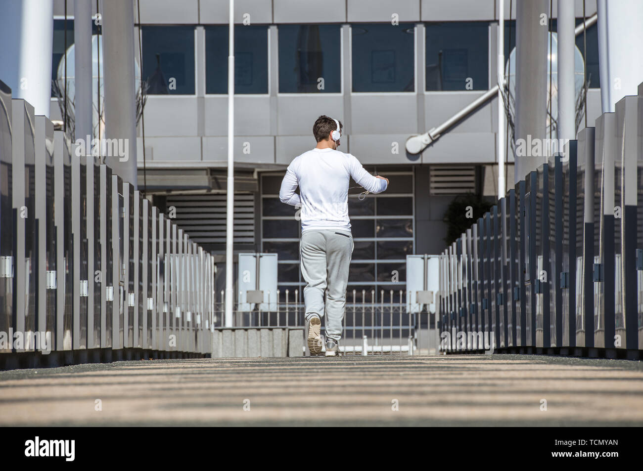 Back view young jogger hi-res stock photography and images - Alamy