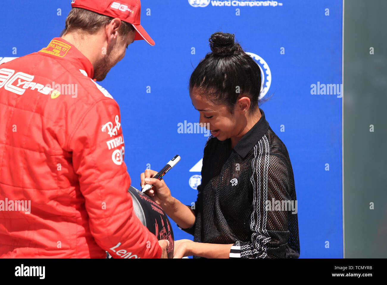 8th June 2019, Circuit Gilles Villeneuve, Montreal, Quebec, Canada; Formula 1 Grand Prix of Canada, qualifying sessions; Scuderia Ferrari, Sebastian Vettel takes pole for tomorrows race and receives the Pirelli Pole Position Award from the Pirelli Representative actress Liza Koshy Stock Photo