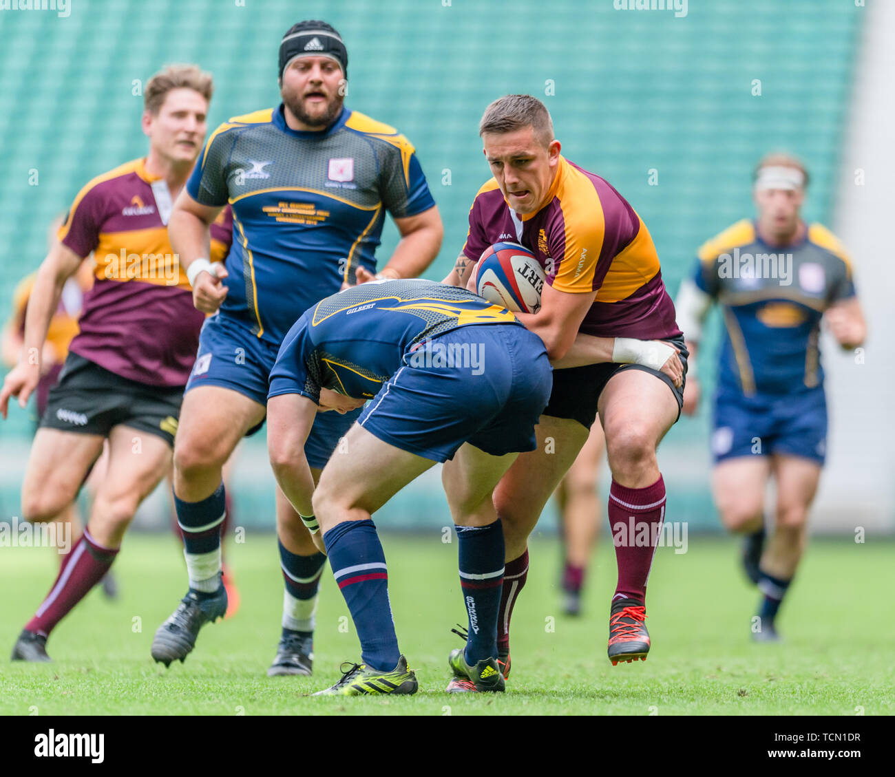 London, UK. 08th, Jun 2019. Leicestershire’s Callum Dacey (centre) is tackled during Bill Beaumont County Championship Division 2 Final: Surrey v Leicestershire at Twickenham Stadium on Saturday, 08 June 2019. LONDON England .  (Editorial use only, license required for commercial use. No use in betting, games or a single club/league/player publications.) Credit: Taka G Wu/Alamy Live News Stock Photo