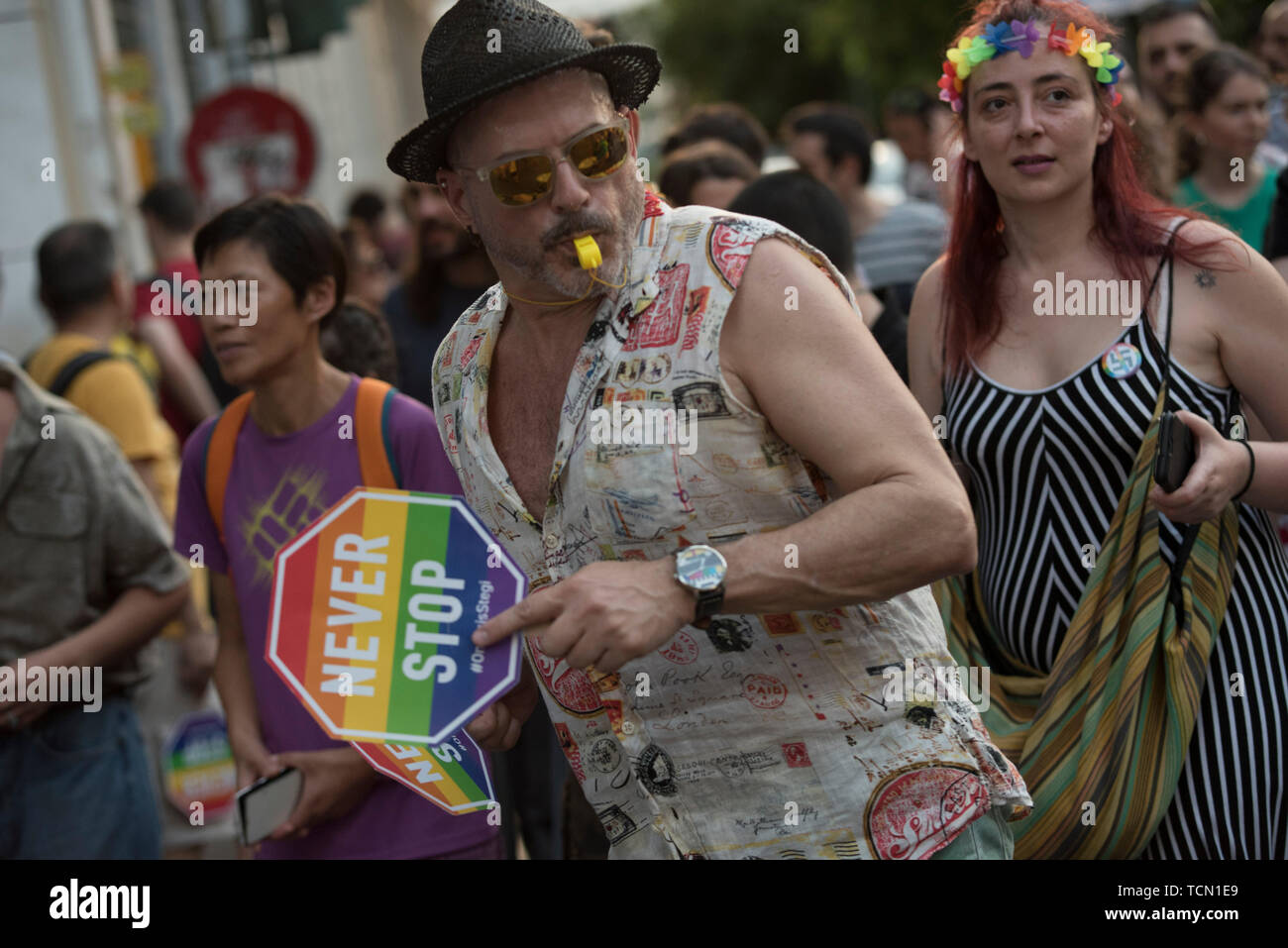 Athens, Greece. 8th June 2019. People march dancing, waving rainbow flags and holding placards during the Athens Pride 2019 parade. Thousands joined the Athens Pride annual event which was this year dedicated to Zak Kostopoulos, the LGBTQ activist who was beaten to death in broad daylight back in September 2018. Credit: Nikolas Georgiou/Alamy Live News Stock Photo