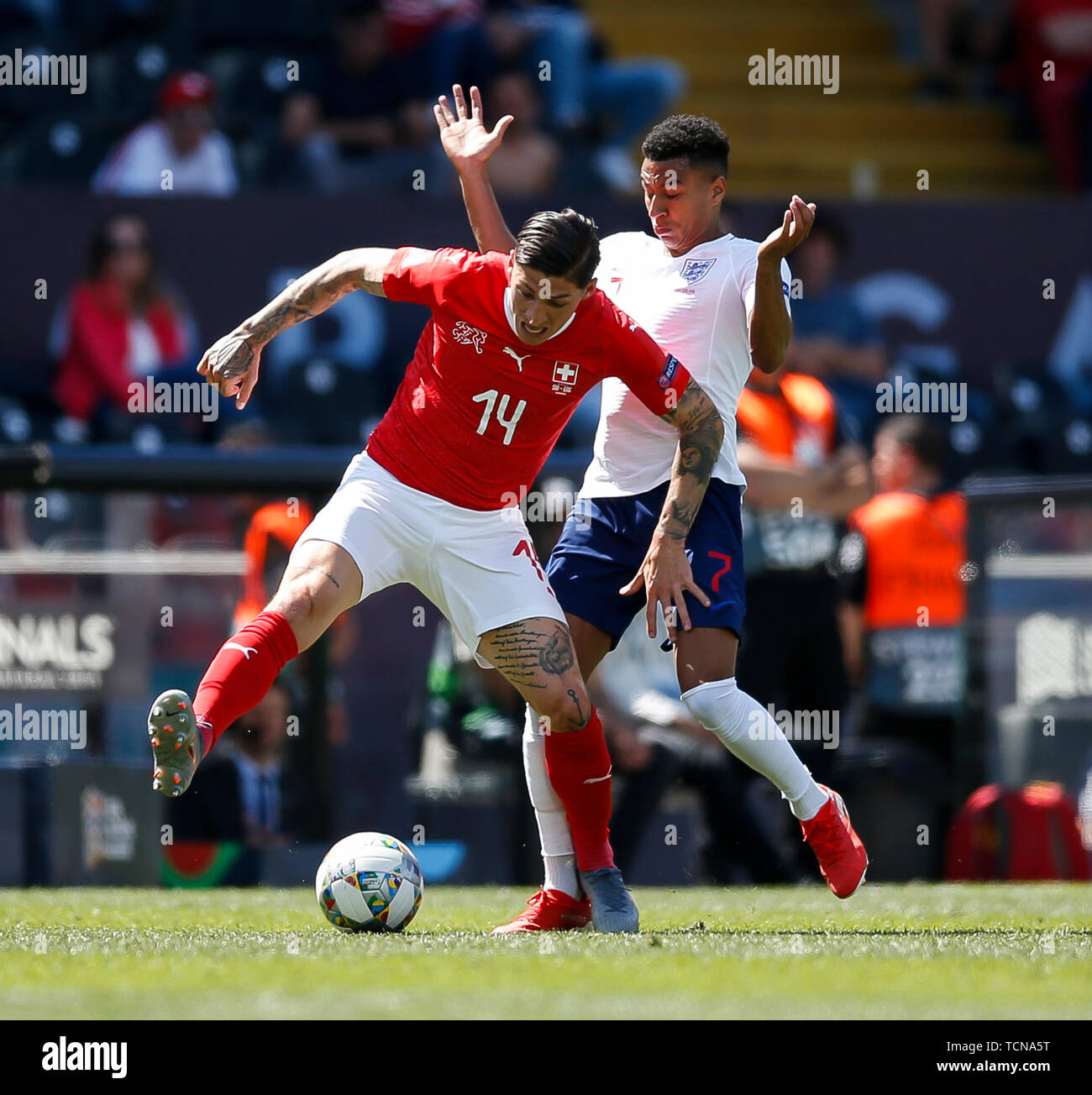 Guimaraes, Portugal. 09th June, 2019. Steven Zuber of Switzerland and Jesse Lingard of England during the UEFA Nations League Third Place Play-Off match between Switzerland and England at Estadio D. Afonso Henriques on June 9th 2019 in Guimaraes, Portugal. (Photo by Daniel Chesterton/phcimages.com) Credit: PHC Images/Alamy Live News Stock Photo