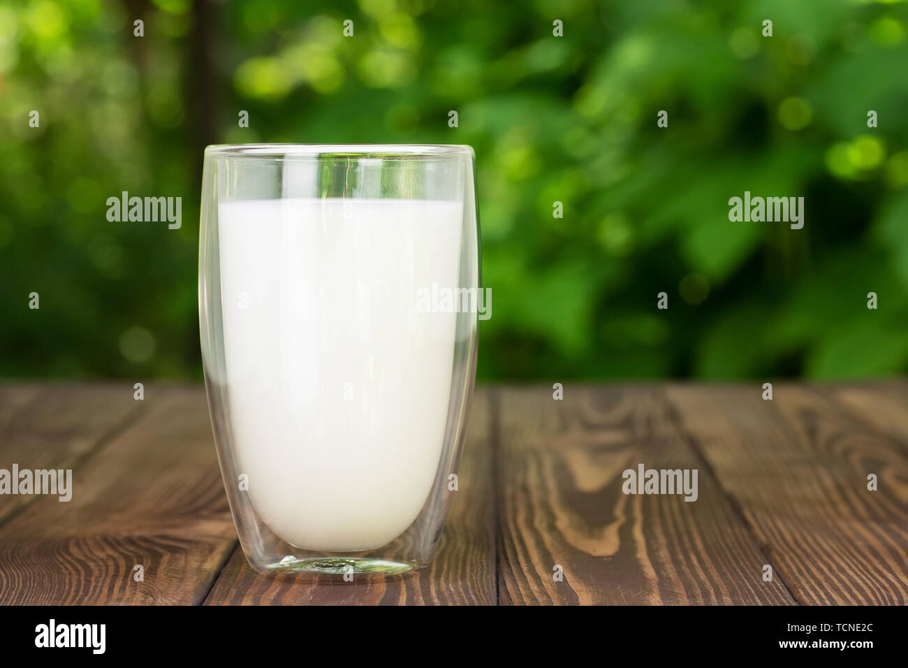 milk in glass on table Stock Photo