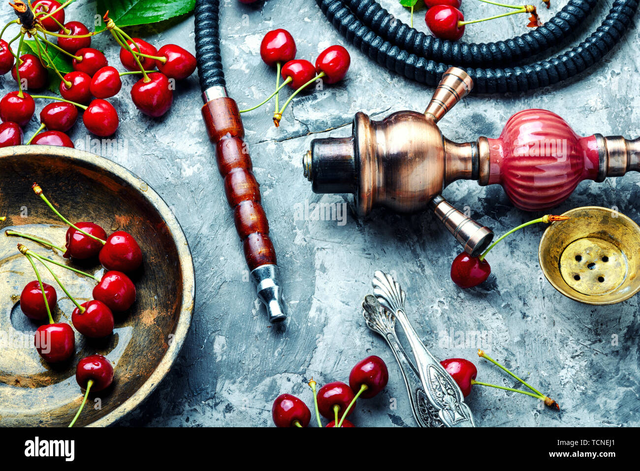 Smoking hookah.Fruit shisha.Eastern smoking nargile with cherry flavor