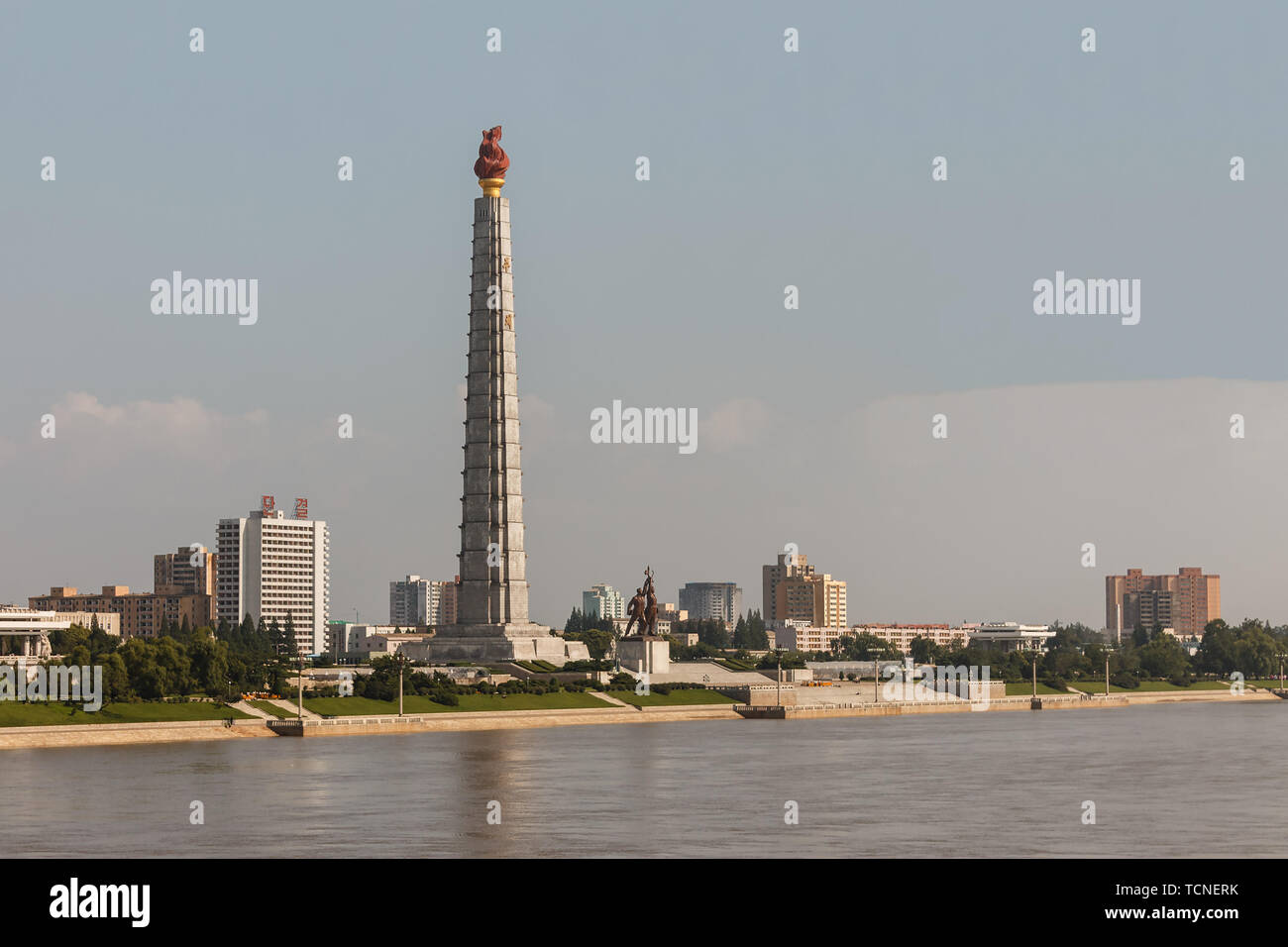 Pyongyang, North Korea - July 27, 2019: Monument to the Juche idea, Tower of the Juche Ideology in the Pyongyang and Taedong River. Stock Photo