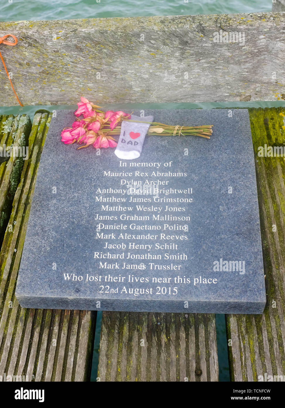 Memorial plaque commemorating the men who died when a Hawker Hunter jet crashed on to the A27 during an air display at Shoreham Airport in August 2015 Stock Photo