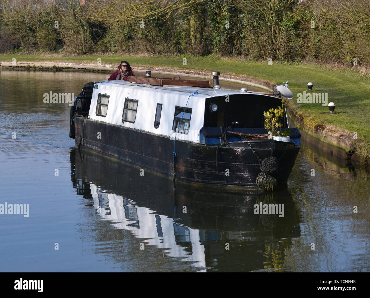 Narrowboat approaching a lock near Tring Reservoirs, on The Grand Union Canal, Aston Clinton, Buckinghamshire / Hertfordshire Border, England, UK Stock Photo