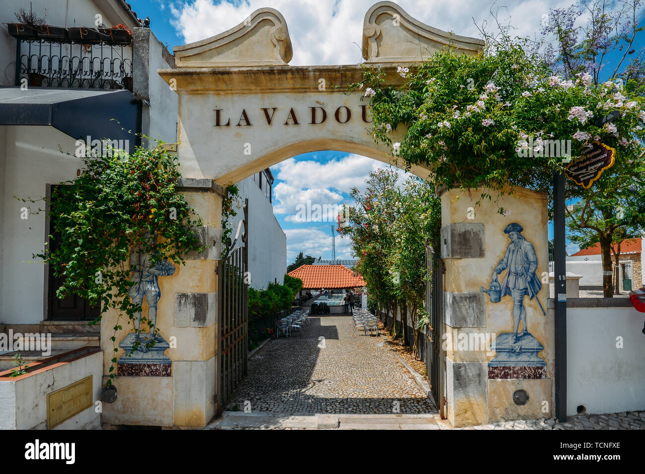Azeitao, Portugal - June 7, 2019: Entrance to a traditional washing basin area converted into a restaurant at the charming village of Azeitao Portugal Stock Photo