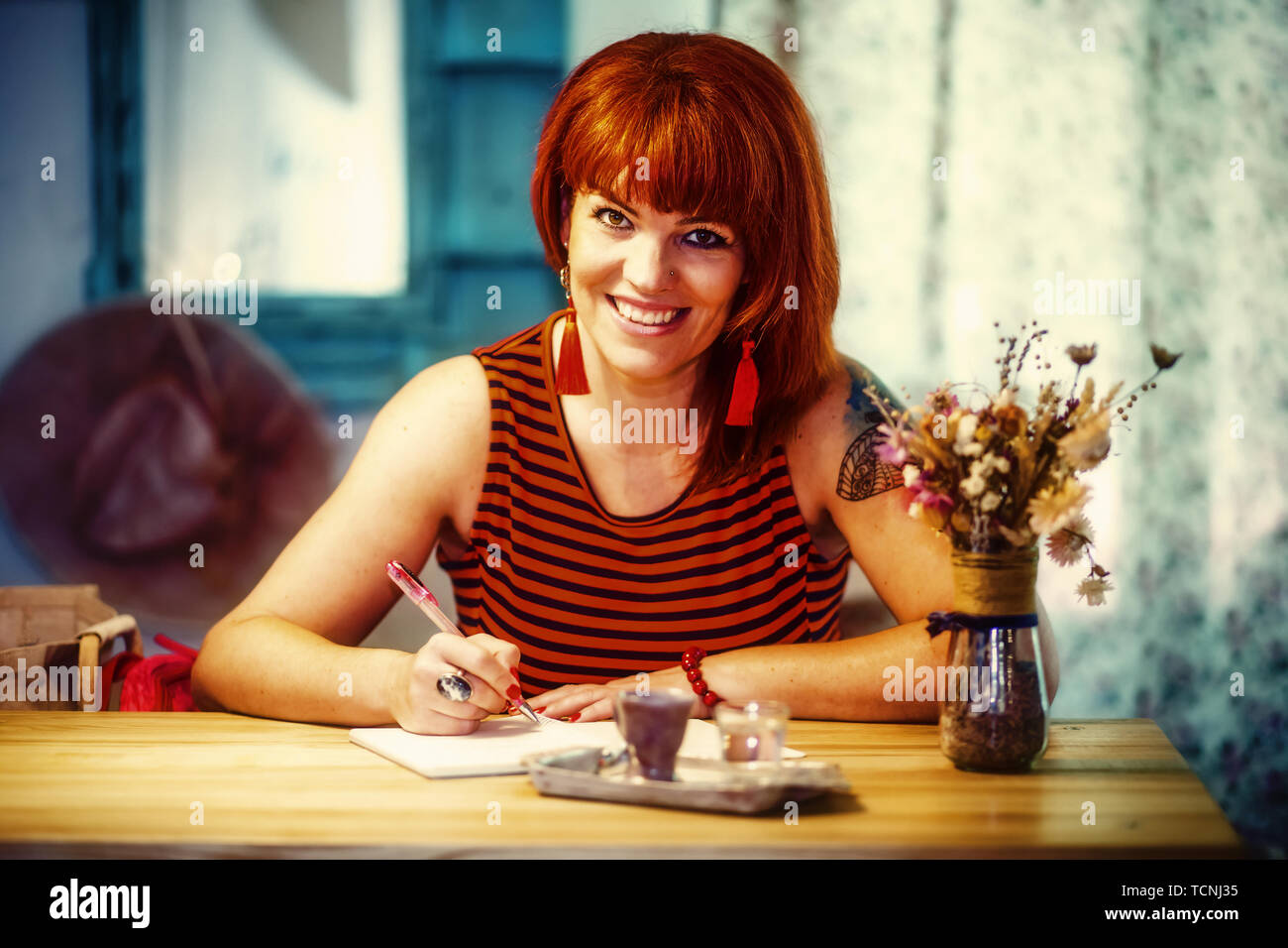 Woman writing journal in coffee hi-res stock photography and images - Alamy