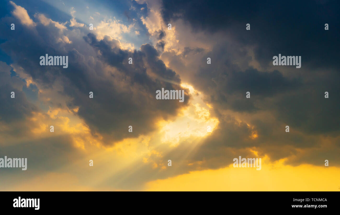 Natural scene Sky clouds and sunrays background Stock Photo