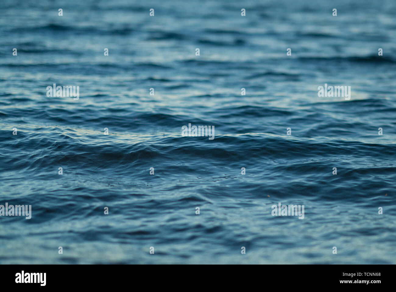 Closeup surface of wavy ocean blue sea water. Abstract Background ...