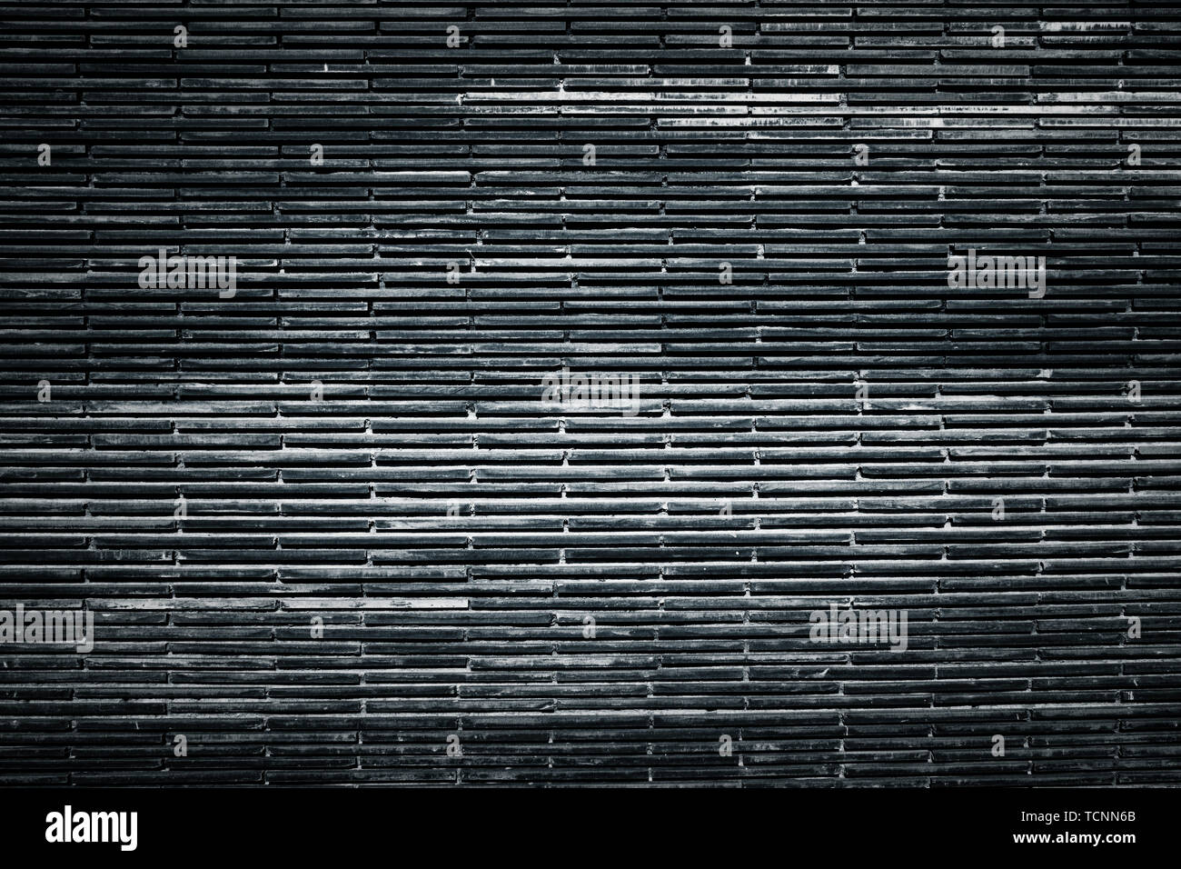 Old black brick wall texture background , graphic ressource . Stock Photo