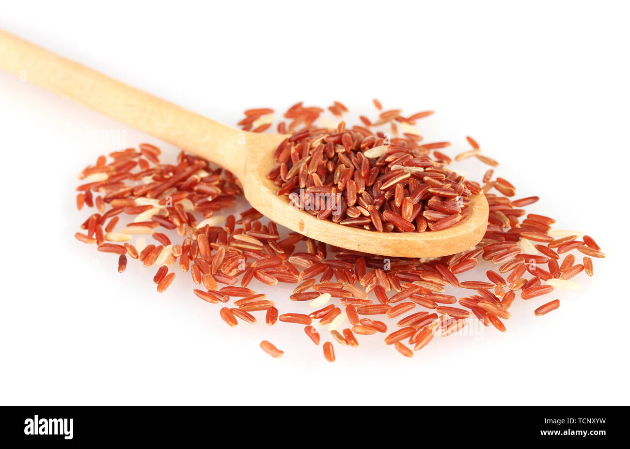 red rice in wooden spoon isolated on white background Stock Photo - Alamy