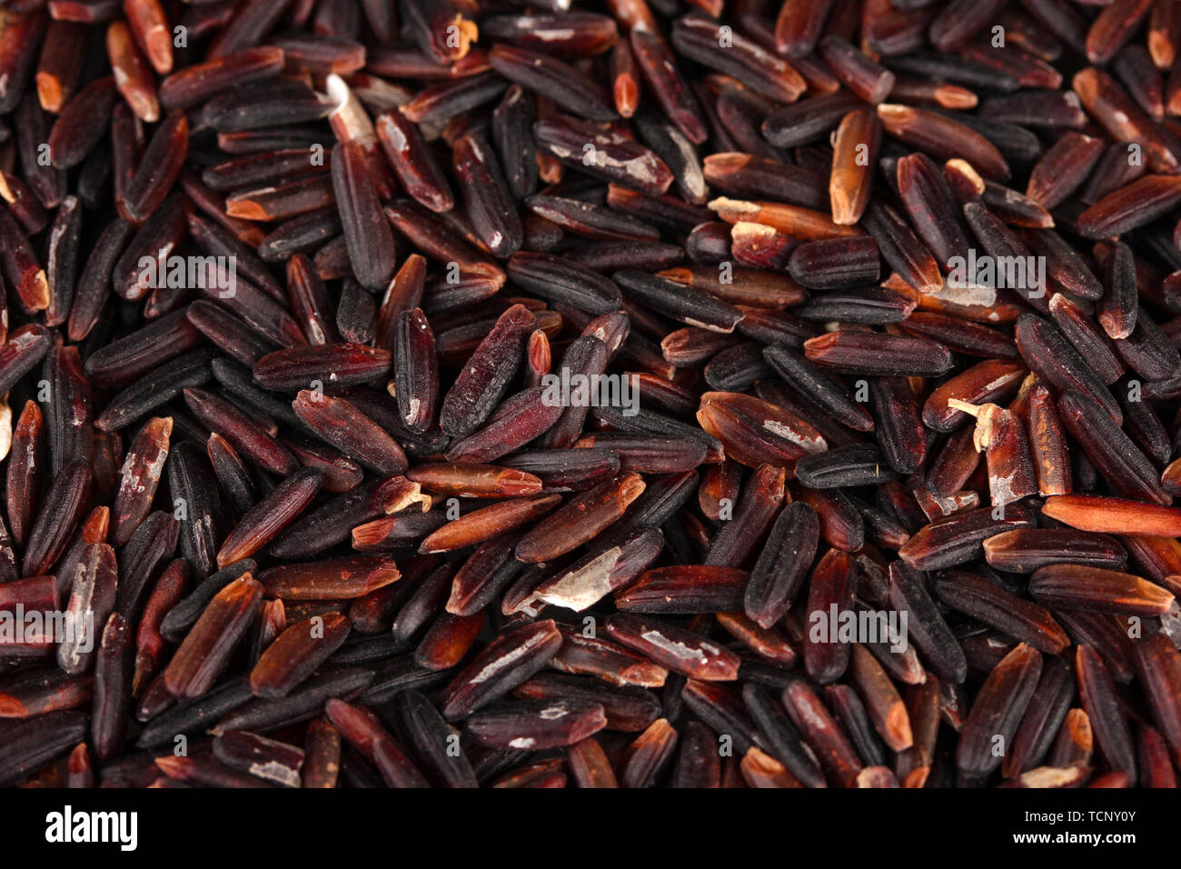 Background black rice Stock Photo - Alamy