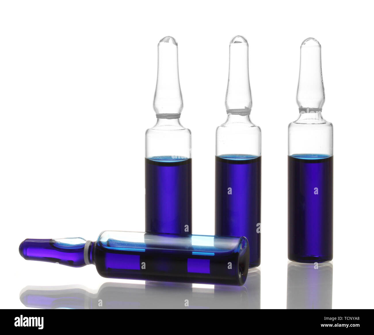 medical ampules with blue liquid, isolated on white Stock Photo Alamy