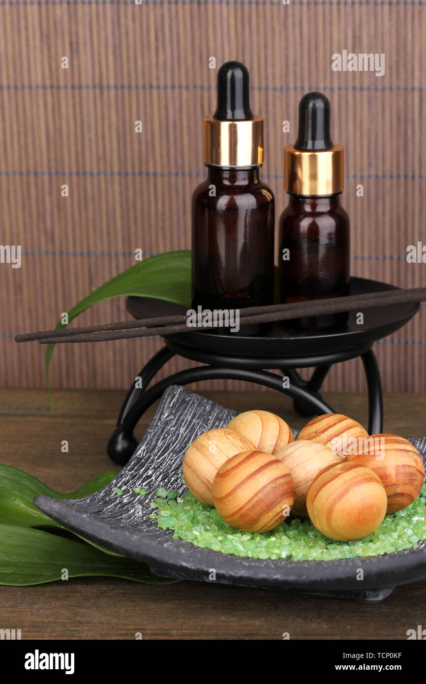 aromatherapy setting on brown bamboo background Stock Photo - Alamy