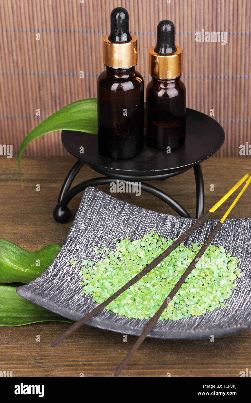 aromatherapy setting on brown bamboo background Stock Photo - Alamy